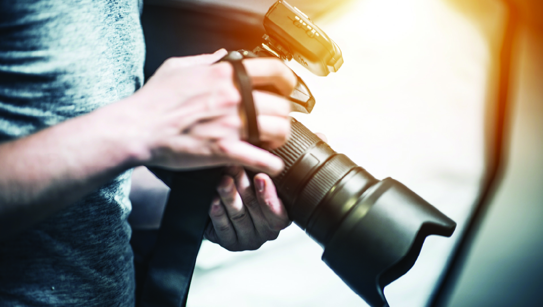 photographer holding digital camera